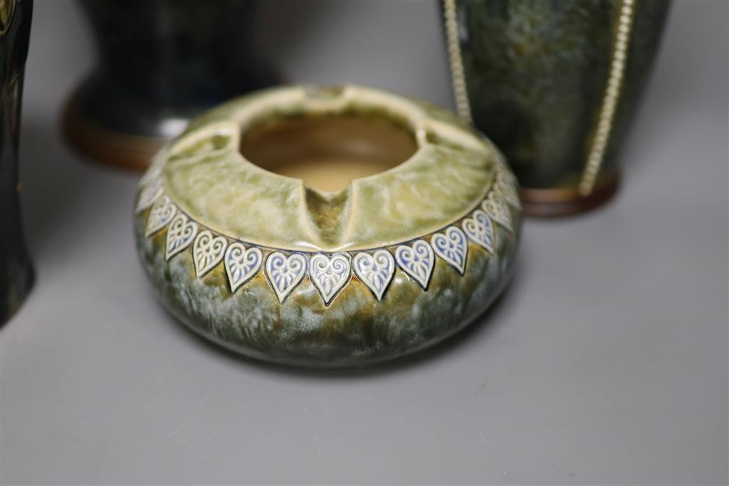 A pair of Royal Doulton vases, a similar larger vase and a small flagon